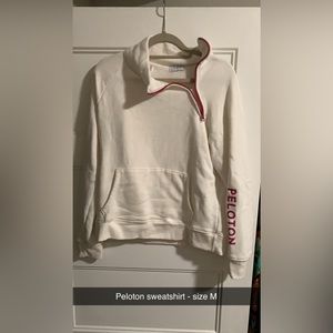 Peloton cream and pink sweatshirt. Like new condition size M
